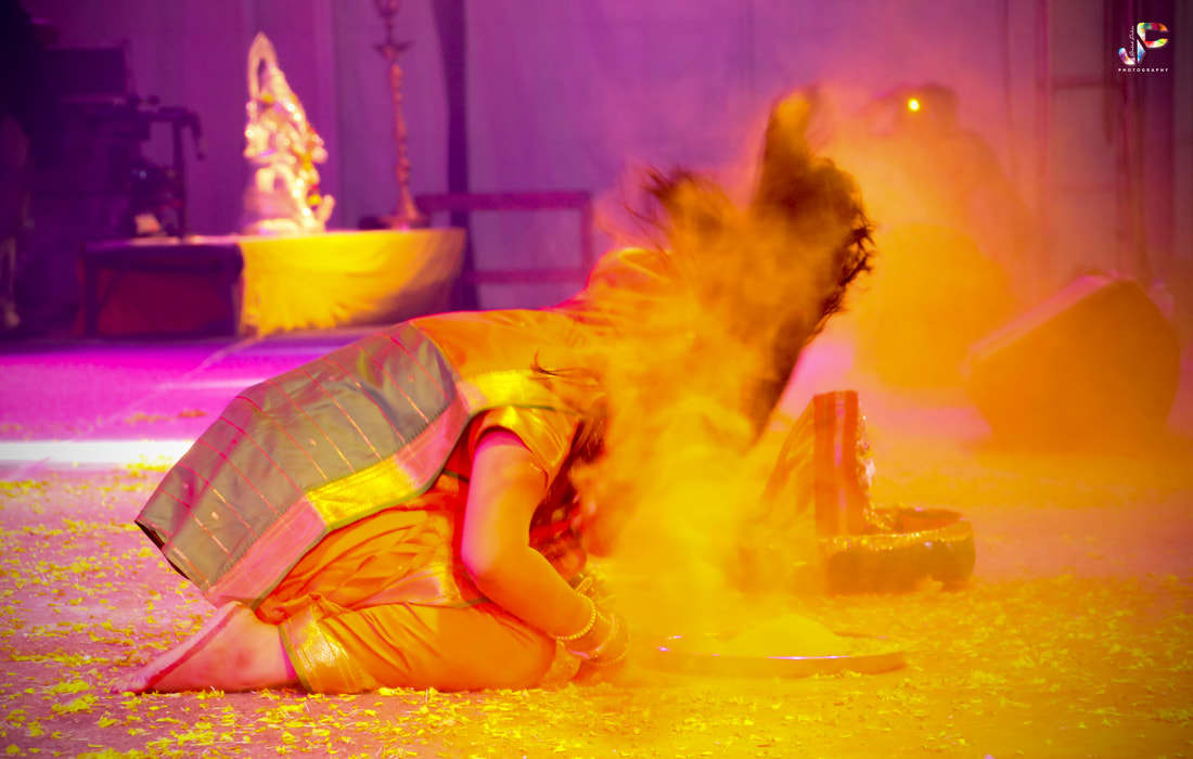 Surat, woman dancing, colourful paint